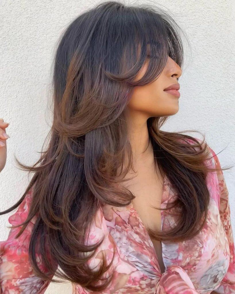 long layered butterfly haircut with volume and movement